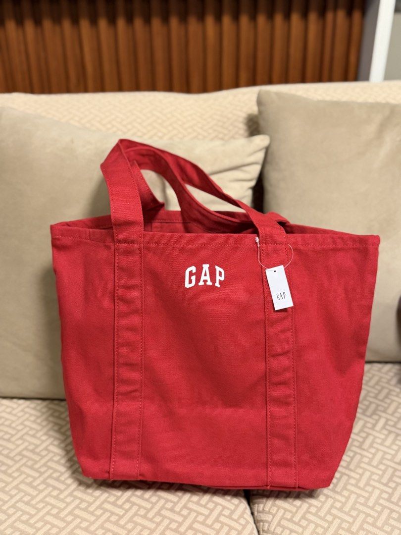 GAP Canvas Tote Bag - Multiple Colors Available (Category: Tote Bags) located in Mandaluyong City. Submitted by treasureeverythingph (Listing ID 1448001048, Image 1). Description: - Cute GAP canvas tote bags - Availablee colors: Red, Yellow, Pink, Purple - Perfect for everyday use, books, or groceries - Durable material - Includes inner pockets Mandaluyong .