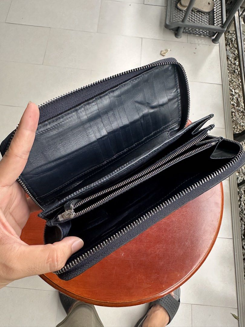 Gucci Long Leather Zip Around Wallet (Category: Luxury Bags & Wallets) located in Quezon City. Submitted by jaypee.abergas (Listing ID 1447975313, Image 3). Description: - Authentic Gucci Guccissima long wallet - Black leather with signature GG embossed pattern - Zip-around closure for security - Multiple card slots and compartments for excellent organization - Minor signs of wear on the interior press marks - Exterior is clean and well-maintaine