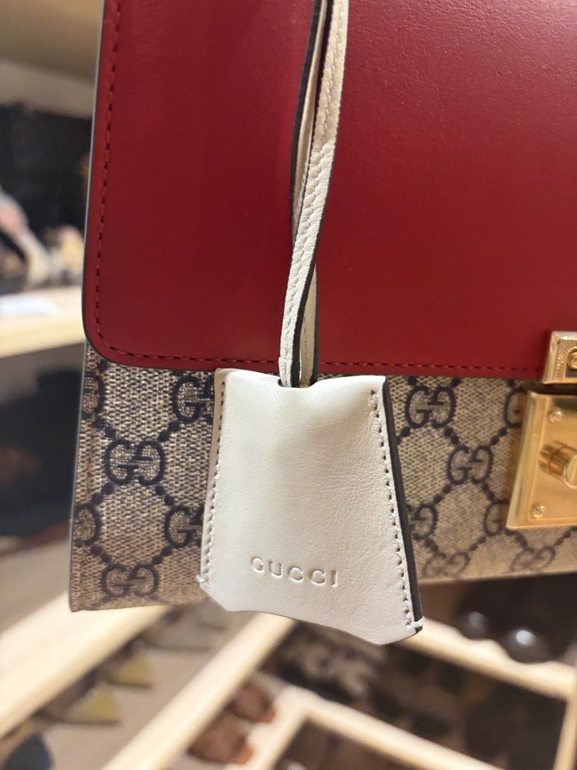 Gucci Padlock GG Medium (Category: Luxury Bags & Wallets) located in Manila. Submitted by preloved_tdc (Listing ID 1448016430, Image 3). Description: - Authentic Gucci shoulder/ sling bag - Iconic GG Supreme canvas with red leather accents - Gold-tone hardware and chain strap - Secure lock closure - Interior zip pocket and card slots - Includes Gucci leather tag -with dust bah .