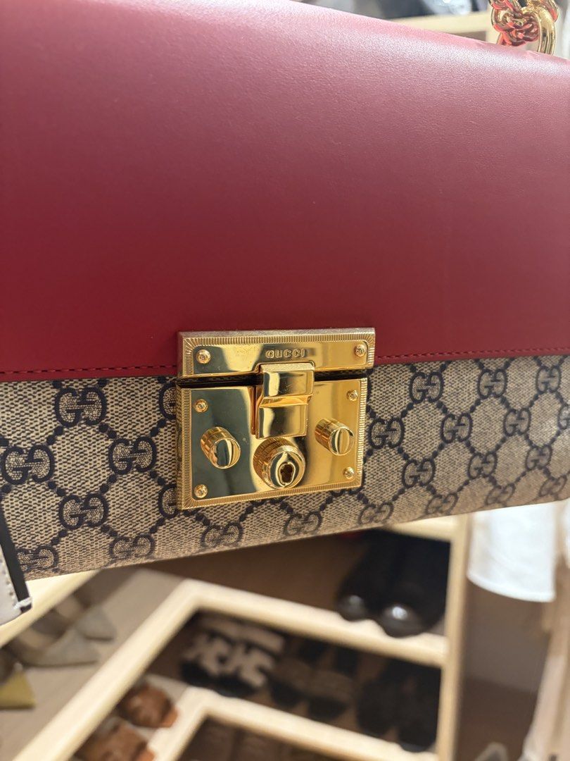 Gucci Padlock GG Medium (Category: Luxury Bags & Wallets) located in Manila. Submitted by preloved_tdc (Listing ID 1448016430, Image 2). Description: - Authentic Gucci shoulder/ sling bag - Iconic GG Supreme canvas with red leather accents - Gold-tone hardware and chain strap - Secure lock closure - Interior zip pocket and card slots - Includes Gucci leather tag -with dust bah .