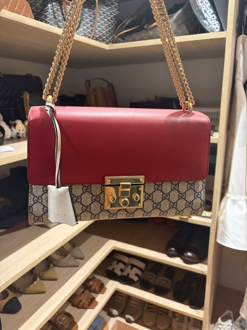 Gucci Padlock GG Medium (Category: Luxury Bags & Wallets) located in Manila. Submitted by preloved_tdc (Listing ID 1448016430, Image 1). Description: - Authentic Gucci shoulder/ sling bag - Iconic GG Supreme canvas with red leather accents - Gold-tone hardware and chain strap - Secure lock closure - Interior zip pocket and card slots - Includes Gucci leather tag -with dust bah .