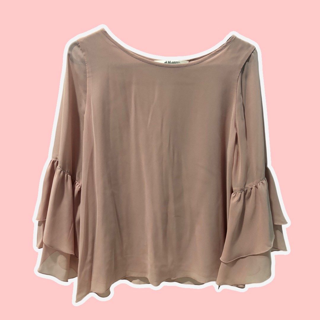 H&M Light Pink Bell Sleeve Chiffon Blouse (Category: Blouses) located in Rizal. Submitted by itzpheebs (Listing ID 1447966921, Image 1). Description: Details: - Light pink chiffon blouse from H&M - Features flowy bell sleeves with double-layer ruffle detail - Lightweight fabric that drapes beautifully - Perfect for dressing up or down - Easy to pair with skirts or pants Payment Method: Gcash or Bank Transfer (BPI) Delivery Method (SHOULDERED BY B