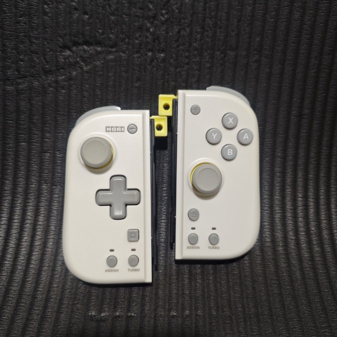 Hori Grip Controller Fit For Nintendo Switch v1/v2 or Oled (Category: Controllers) located in Quezon City. Submitted by shopme_gadget30 (Listing ID 1448024158, Image 1). Description: kindly read the details first for sale fixed price mint Condition good as new tested and working no issue no drifting all buttons working compatible to Nintendo switch v1 , v2 or Oled original Color: Light Gray + Yellow No strap Shoopppppeee —,✅ can check out pm for 