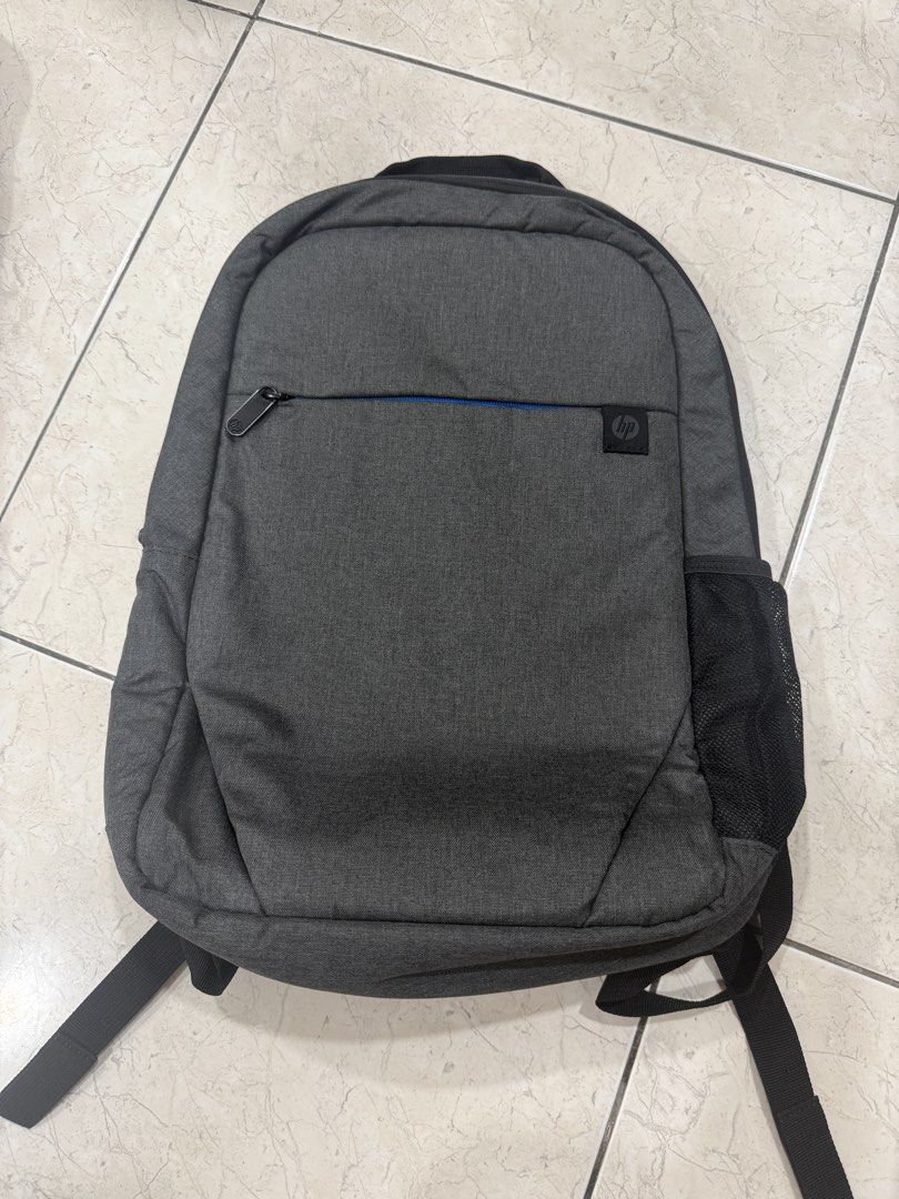 HP Grey Backpack (Category: Backpacks) located in Kuala Lumpur. Submitted by jackson_my_shop (Listing ID 1447963729, Image 1). Description: - Grey HP backpack - Front zip pocket - Side mesh pockets - Main compartment with internal organizers - Padded back and shoulder straps for comfort - Ideal for daily use or travel.