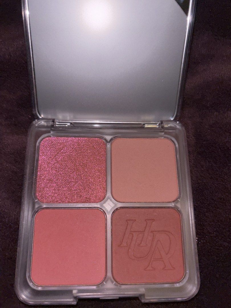 Huda Beauty Eyeshadow gand Blush Palette (Category: Makeup) located in Kuala Lumpur. Submitted by anirudh18 (Listing ID 1448076124, Image 2). Description: - Huda Beauty 4-shade palette - Includes 1 shimmery pink eyeshadow - Features 3 blush shades, one with embossed Huda Beauty logo - Compact size with built-in mirror - Ideal for travel and everyday makeup looks.
