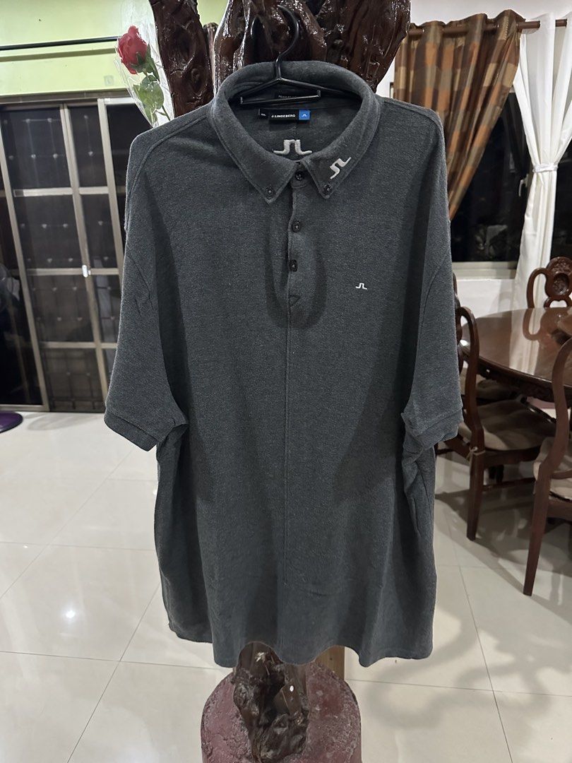 j.lindeberg Polo Shirt - Dark Grey (Category: Tshirts & Polo Shirts ) located in Makati City. Submitted by doidanao (Listing ID 1448043826, Image 1). Description: - Dark grey J.Lindeberg polo shirt - Short sleeves with collar and button placket - Features a small JL logo on the chest - Versatile for golf or casual outings - Made with comfortable material.