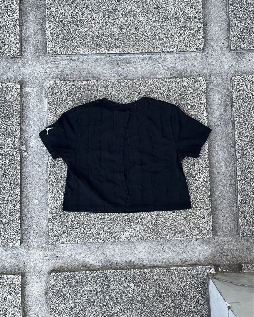 Jordan Black Cropped T-Shirt Size S (Category: Shirts) located in Marikina City. Submitted by lnmrvllr (Listing ID 1448041898, Image 3). Description: - Black Jordan cropped t-shirt - Size: S - Vertical seam details (front and back) - Small Jordan logo on left sleeve cuff - May pagkabackless, zoom in.
