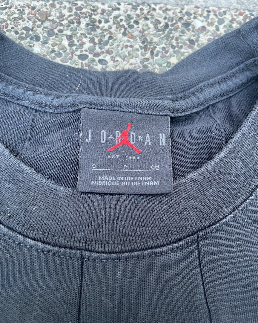 Jordan Black Cropped T-Shirt Size S (Category: Shirts) located in Marikina City. Submitted by lnmrvllr (Listing ID 1448041898, Image 2). Description: - Black Jordan cropped t-shirt - Size: S - Vertical seam details (front and back) - Small Jordan logo on left sleeve cuff - May pagkabackless, zoom in.