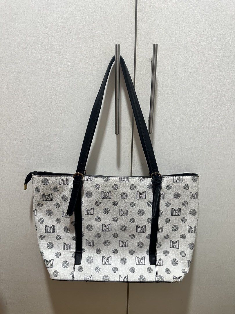 JOVANNI Monogram Tote Bag (Category: Tote Bags) located in Antipolo. Submitted by soshops (Listing ID 1448020102, Image 2). Description: Very Well Used. Measurements: Length: 14-17 inch Height: 11 inch - Interior includes a zippered compartment and slip pockets. - Accented with elegant gold-tone hardware. - Ideal for everyday use and errands..