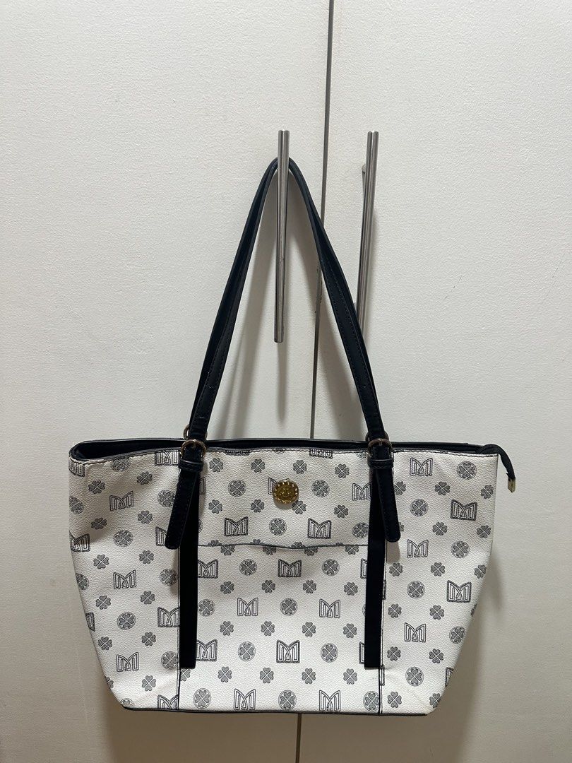 JOVANNI Monogram Tote Bag (Category: Tote Bags) located in Antipolo. Submitted by soshops (Listing ID 1448020102, Image 1). Description: Very Well Used. Measurements: Length: 14-17 inch Height: 11 inch - Interior includes a zippered compartment and slip pockets. - Accented with elegant gold-tone hardware. - Ideal for everyday use and errands..