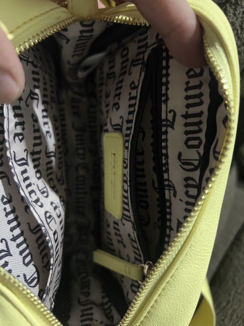 Juicy Couture Obsession Camera Crossbody Yellow Pear (Category: Cross-body Bags) located in Baliuag. Submitted by sol_marie03 (Listing ID 1448004428, Image 2). Description: - Authentic Juicy Couture crossbody bag - Vibrant Yellow Pear color - Features 'Juicy' logo with sparkling rhinestones on the front - Interior lined with signature Juicy Couture print - Adjustable strap for comfortable wear - Style name: Obsession Camera Crossbody.