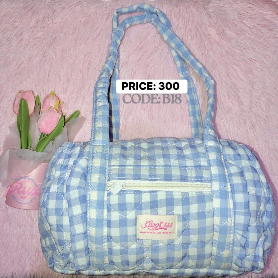 KingKiss Blue Gingham Quilted Barrel Bag (Category: Shoulder Bags) located in Manila. Submitted by impulxy_ve (Listing ID 1448074673, Image 1). Description: - Adorable blue gingham barrel bag - Soft quilted material all over - Secure zipper closure on top - Features a cute "KingKiss" tag - Ideal for everyday use - Price: 300 LOC PAMPANGA (CAN SHIP NATIONWIDE VIA J&T).