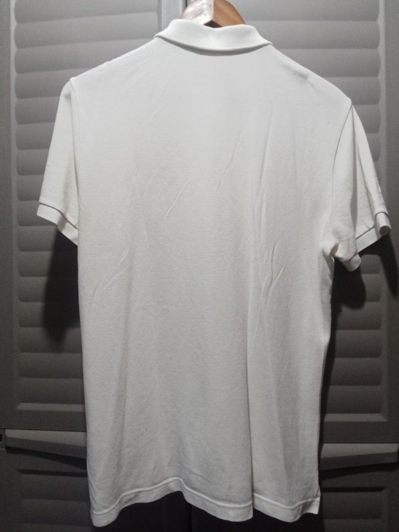 Lacoste Live White Polo Shirt (Category: Tshirts & Polo Shirts ) located in Makati City. Submitted by kuysman (Listing ID 1447932741, Image 2). Description: only sensible questions are entertained 1 left actual measurement 21 x 27".