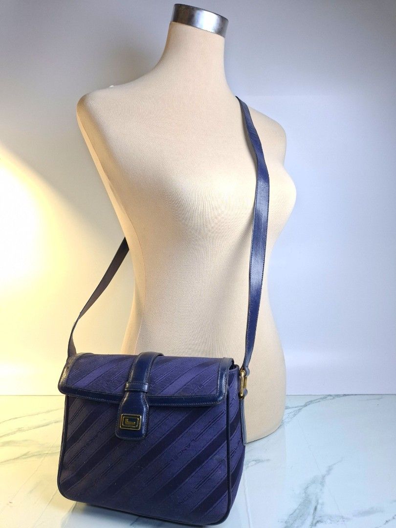 Lancel Paris Vintage Monogram Canvas Shoulder Bag (Category: Luxury Bags & Wallets) located in Pasay City. Submitted by onick_79 (Listing ID 1448072866, Image 3). Description: Lancel Paris Vintage Monogram Canvas Shoulder Bag - Jacquard monogram canvas with genuine leather trim - Deep navy blue with gold-tone hardware - Flap design with signature L buckle and magnetic closure - Spacious interior for daily essentials - Dimensions: 24 × 18 × 8 cm.