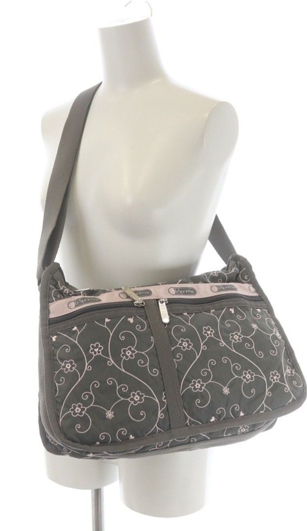 LeSportsac Deluxe Everyday Bag (Category: Shoulder Bags) located in Muntinlupa City. Submitted by kmrod (Listing ID 1447985399, Image 2). Description: - Stylish gray and pink LeSportsac shoulder bag - Features a pretty pink floral vine embroidered pattern - Adjustable strap with buckle for customized fit - Multiple zippered pockets on the front for secure storage - Ideal size for everyday use and carrying essentials Approximate Dimensions: Height