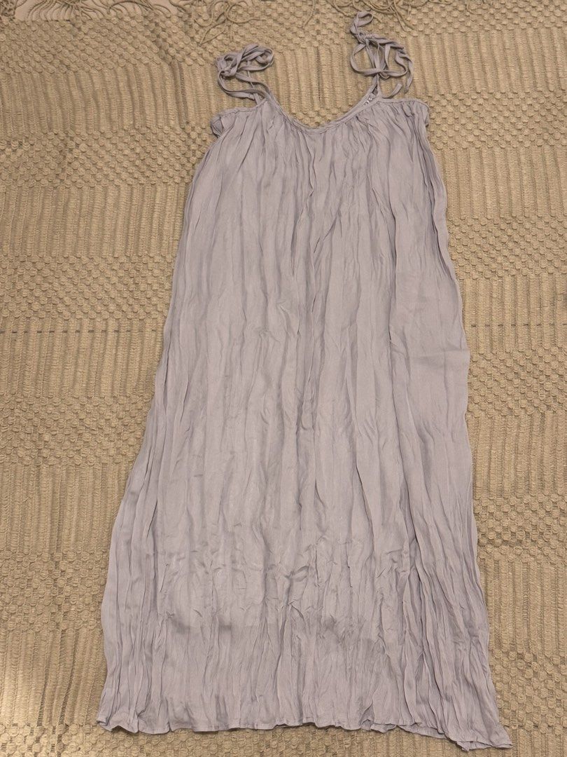 Light Purple Crinkled Midi Dress with Tie Straps (Category: Dresses) located in Petaling Jaya. Submitted by nanalittlestar (Listing ID 1448010156, Image 1). Description: - Light purple midi dress - Crinkled fabric texture all over - Adjustable tie straps on shoulders - Flowy, relaxed fit - Ideal for casual wear or as a beach cover-up - Brand new with original tag attached.