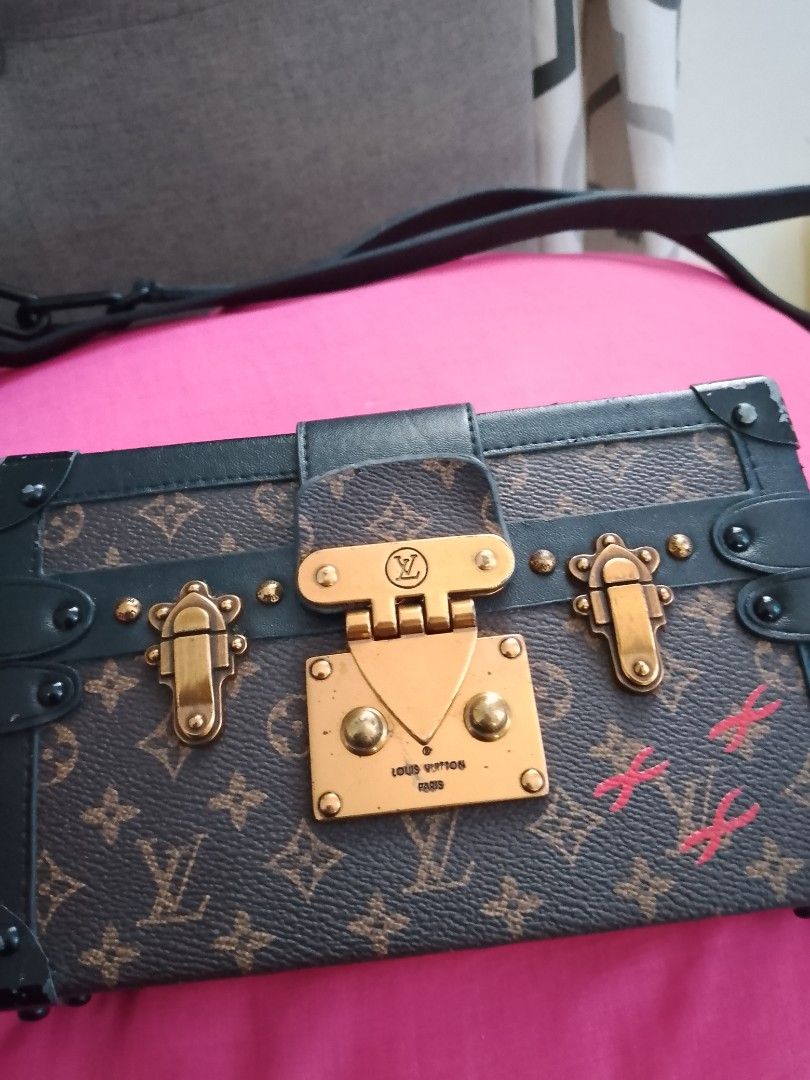 Louis Vuitton Monogram Trunk Bag (Category: Luxury Bags & Wallets) located in Carmen. Submitted by badkiss_coffee26 (Listing ID 1447749345, Image 3). Description: - Pre-owned Louis Vuitton trunk bag - Classic monogram canvas - Elegant gold hardware - Secure clasp closure - Includes detachable strap - A unique statement piece for collectors.