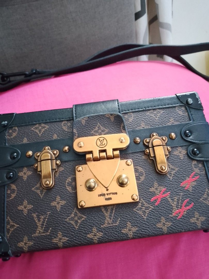 Louis Vuitton Monogram Trunk Bag (Category: Luxury Bags & Wallets) located in Carmen. Submitted by badkiss_coffee26 (Listing ID 1447749345, Image 1). Description: - Pre-owned Louis Vuitton trunk bag - Classic monogram canvas - Elegant gold hardware - Secure clasp closure - Includes detachable strap - A unique statement piece for collectors.
