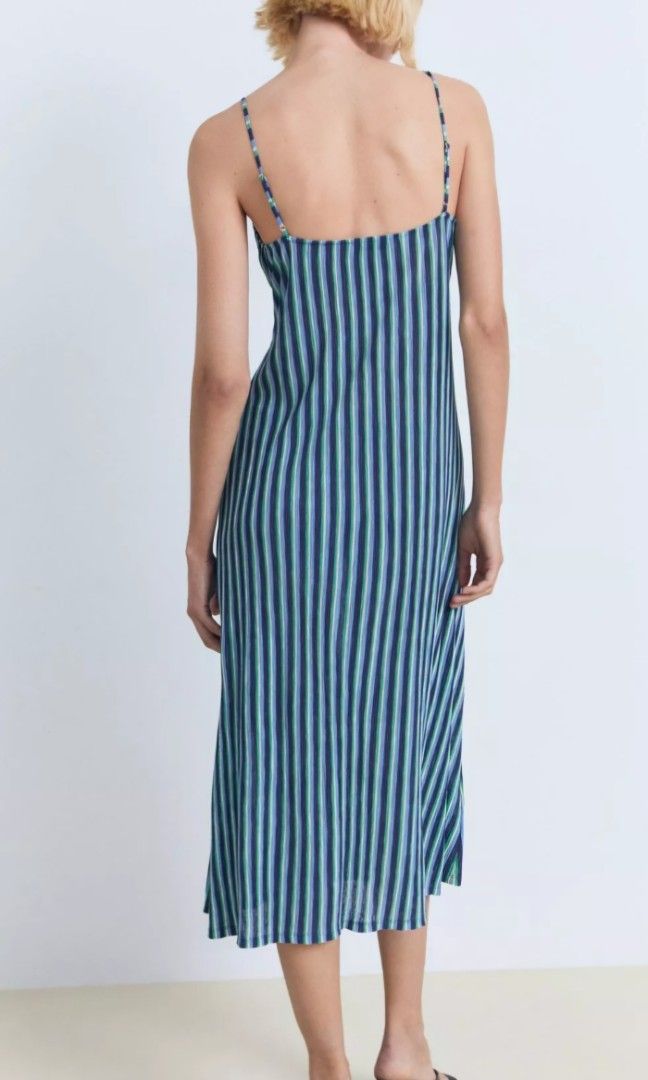 Mango Blue Striped Midi Dress with Twist Front (Category: Dresses) located in Davao. Submitted by sachigo (Listing ID 1447963934, Image 2). Description: - Stylish blue and white stripe midi dress - Features a flattering twist detail at the bust - Delicate thin spaghetti straps - Hemline falls below the knee - Versatile for casual days or beach vacations - Effortless to wear and style.
