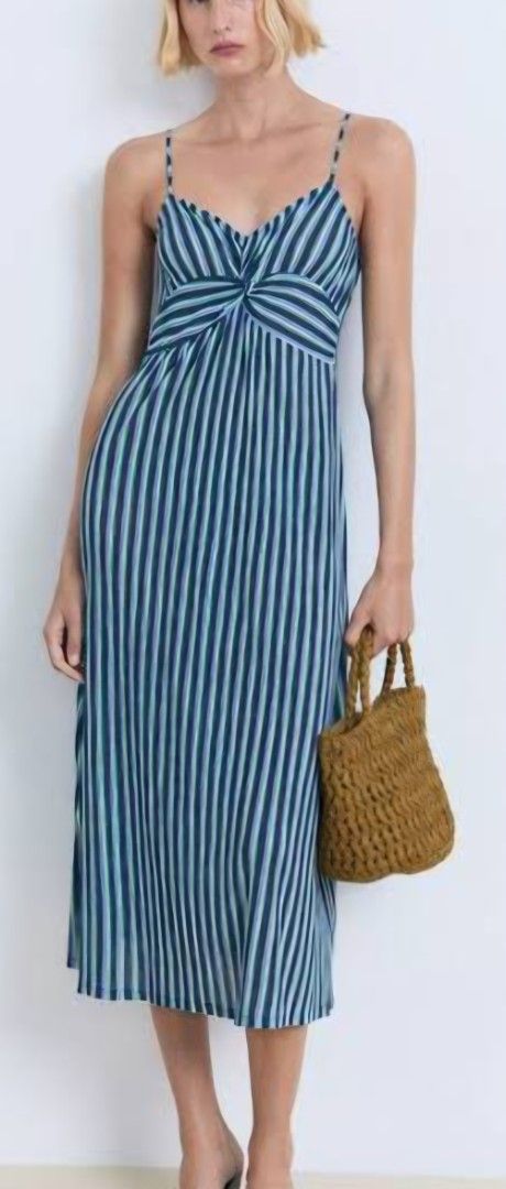 Mango Blue Striped Midi Dress with Twist Front (Category: Dresses) located in Davao. Submitted by sachigo (Listing ID 1447963934, Image 1). Description: - Stylish blue and white stripe midi dress - Features a flattering twist detail at the bust - Delicate thin spaghetti straps - Hemline falls below the knee - Versatile for casual days or beach vacations - Effortless to wear and style.
