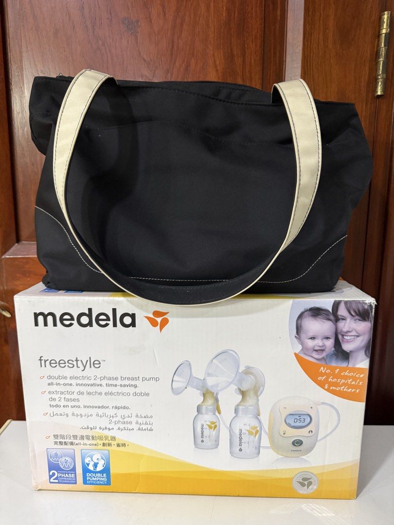 Medela Freestyle Double Electric Breast Pump (Category: Breastfeeding & Bottle Feeding) located in Quezon City. Submitted by cmgood (Listing ID 1447971986, Image 1). Description: - Medela Freestyle double electric breast pump - Includes: 2 breast shields, bottles, tubing, power adapter - Bonus: Extra set of 27mm breast shields - Designed for efficient milk expression - All parts neatly organized in original box - With Original MEDELA Bag - Bought