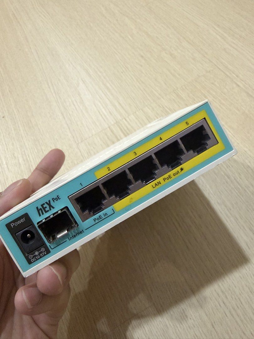 MikroTik hEX PoE RB960PGS (Category: Networking) located in Kuala Lumpur. Submitted by thisissidq (Listing ID 1448013822, Image 1). Description: MikroTik hEX PoE RB960PGS ✔ Fully working ✔ Cleaned & reset ✔ Normal used condition ✔ Slight yellowing due to age ✔ Port 3 LED cover has a small hole (taped, cosmetic only) ✔ SFP port metal shield slightly bent (does not affect function) Features: * 5× Gigabit Ethernet * PoE In & PoE Out.