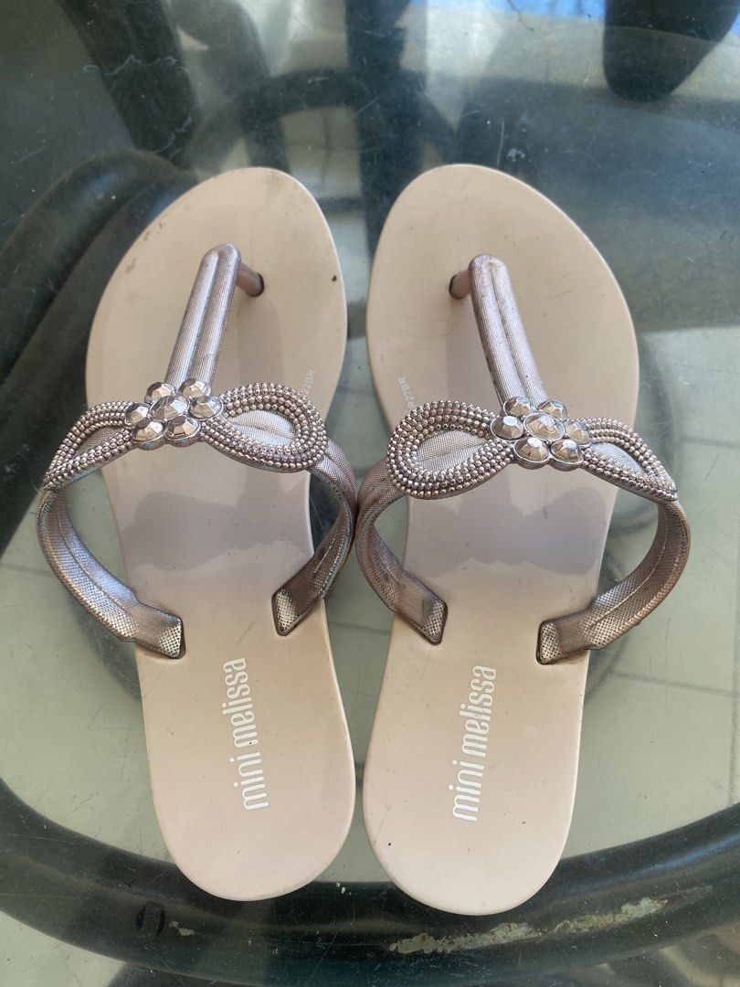 Mini Melissa Rose Gold Embellished Flip-Flops (Category: Babies & Kids Fashion) located in Manila. Submitted by kirstencloset (Listing ID 1447917404, Image 1). Description: - Decluttering - Rose gold flip-flops from Mini Melissa - Size US: 13 - Features a pretty bow embellishment with rhinestones on the straps - Easy slip-on design - Soles show some signs of wear - Great for casual outings.