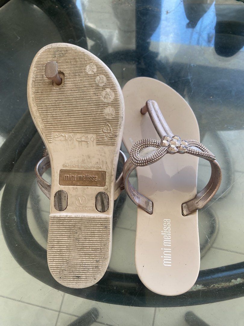 Mini Melissa Rose Gold Embellished Flip-Flops (Category: Babies & Kids Fashion) located in Manila. Submitted by kirstencloset (Listing ID 1447917404, Image 3). Description: - Decluttering - Rose gold flip-flops from Mini Melissa - Size US: 13 - Features a pretty bow embellishment with rhinestones on the straps - Easy slip-on design - Soles show some signs of wear - Great for casual outings.