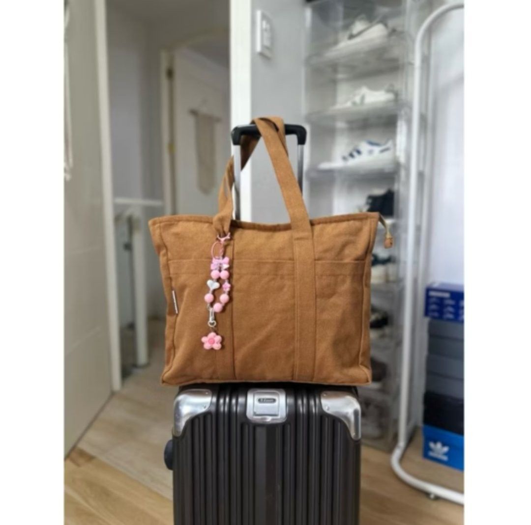 Multi compartment tote bag (Category: Tote Bags) located in Guagua. Submitted by eacords (Listing ID 1448055843, Image 2). Description: - Multi-compartment tote bag - Zipper closure with inner lining - Perfect for laptops, books, and folders - Large size (13"x15"x3") - Durable canvas material - Great for daily use and travel.