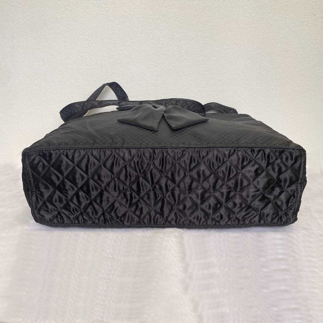 NaRaYa Black Quilted Large Weekender Bow Tote Bag (Category: Tote Bags) located in Cebu City. Submitted by posh_avenue888 (Listing ID 1448050765, Image 3). Description: In very good condition. From Japan. Crafted in satin-like fabric material. 100% authentic!!! 18.5" x 14" x 5.5". .