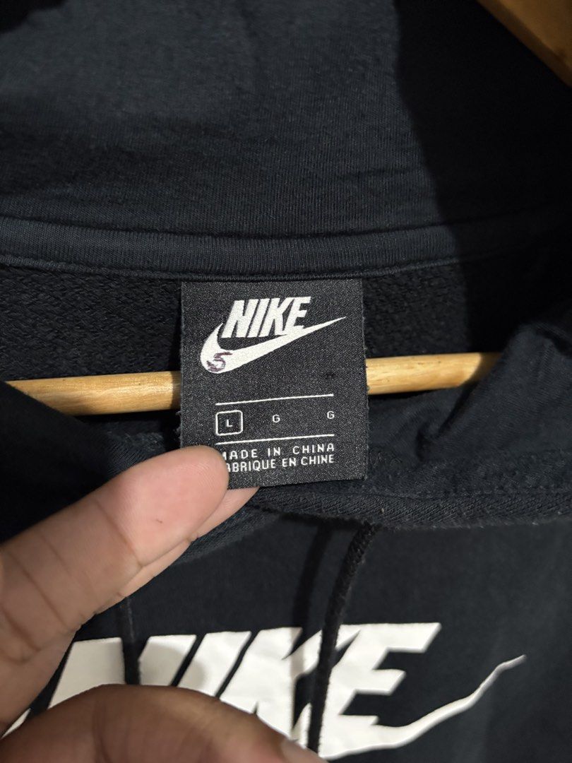 Nike Black Hoodie with White Logo (Category: Hoodies) located in Cabanatuan. Submitted by chingweyyy (Listing ID 1447904884, Image 3). Description: - Classic black Nike hoodie - Iconic white Nike logo on front - Front pocket - Adjustable drawstring hood - Size: L - Made in China - Ideal for casual wear or workouts -Dimension ( 24 Width x 26 Length) .