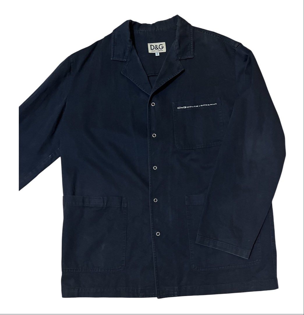 OG D&G Dolce & Gabbana Black Button-Up Jacket (Category: Coats, Jackets and Outerwear) located in Quezon City. Submitted by letsdeclutter101 (Listing ID 1447936429, Image 3). Description: OG Black D&G jacket. Button-up front with two front pockets. Small D&G logo on the chest pocket. Made in Italy. Tag size 36/50. color rate; 8/10.