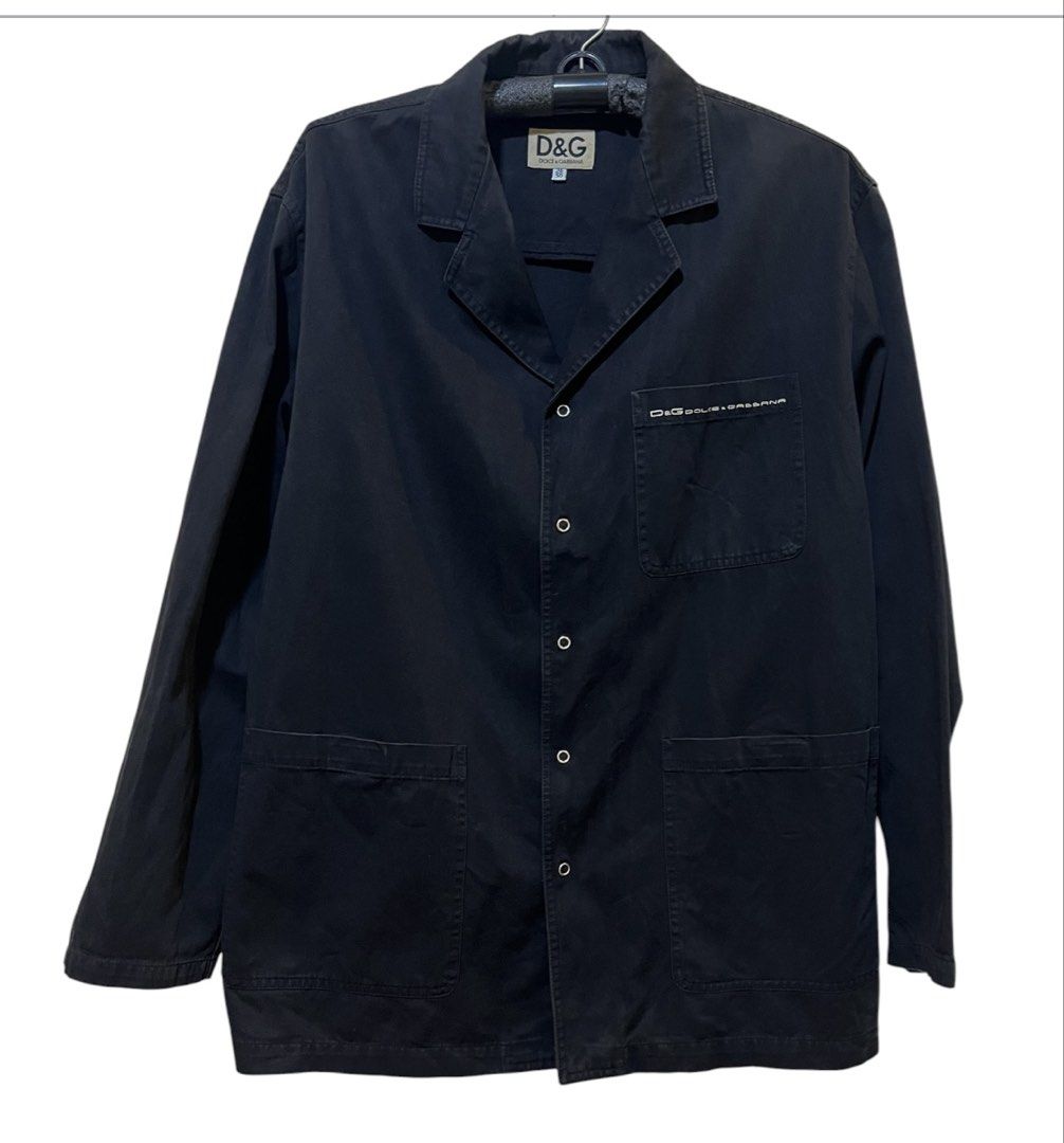 OG D&G Dolce & Gabbana Black Button-Up Jacket (Category: Coats, Jackets and Outerwear) located in Quezon City. Submitted by letsdeclutter101 (Listing ID 1447936429, Image 2). Description: OG Black D&G jacket. Button-up front with two front pockets. Small D&G logo on the chest pocket. Made in Italy. Tag size 36/50. color rate; 8/10.