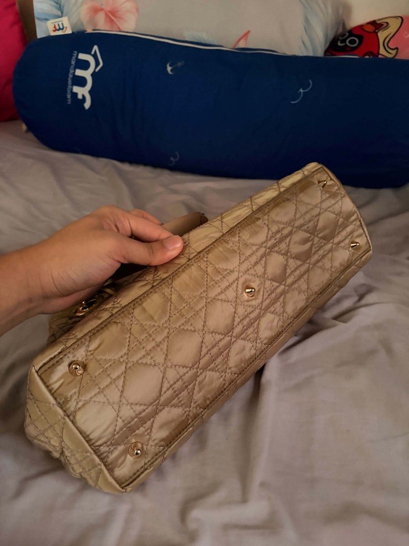 Original Dior Charming Lock Flap bag (Category: Luxury Bags & Wallets) located in Rizal. Submitted by bingbong21 (Listing ID 1447535549, Image 3). Description: - Authentic gold Dior shoulder bag - Elegant quilted pattern all over - Iconic Dior charms attached - Stylish chain strap - Secure front flap with clasp closure - Versatile for daily wear or special events - Note: Shows some signs of wear on the corners -shipping via JNT and lalamove.