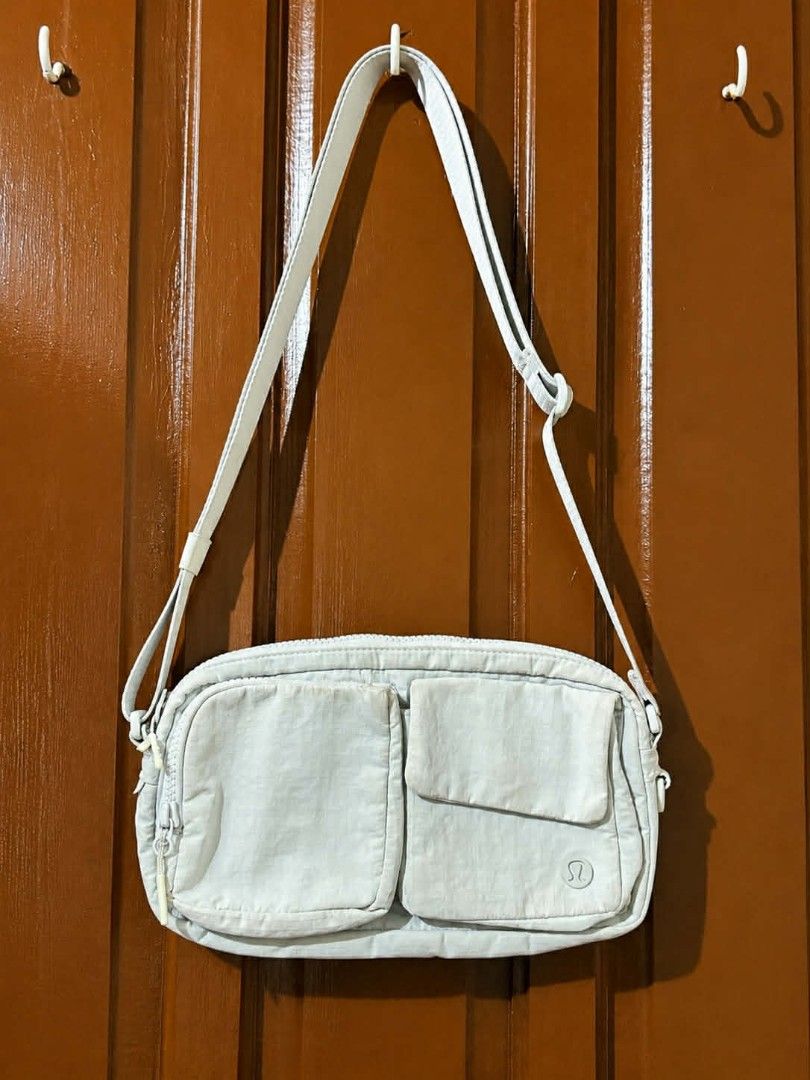 Original Lululemon Crossbody Bag White Opal (Category: Cross-body Bags) located in Calauan. Submitted by thatchic_8 (Listing ID 1447945525, Image 2). Description: (PRICE NEGOTIABLE) ✔ 100% Authentic ✔ Adjustable strap ✔ Multiple pockets and compartments ✔ Clean interior ✔ Zippers and magnetic closures working properly ✔ Good overall condition ✔ Minimal signs of use (please refer to photos) Perfect for daily errands, travel, gym, and casual outfit