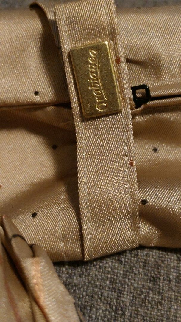AUTHENTIC Orobianco Folding Umbrella - Beige with Black Dots (Category: Umbrellas) located in Davao. Submitted by warmdeer-4ae1 (Listing ID 1448062864, Image 3). Description: - Authentic OROBIANCO ompact folding umbrella - Beige fabric with small black dots - Includes a matching sleeve with zipper closure - Ornate gold emblem on the handle - Easy to carry, ideal for unexpected rain.