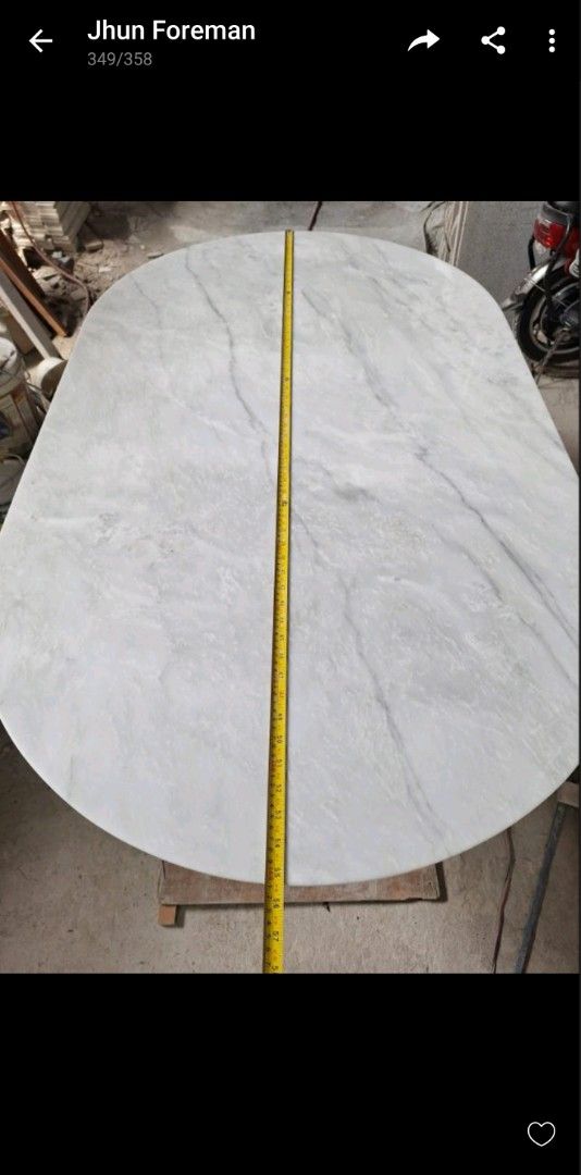 Oval Marble Dining Table with Black Star Base (Category: Tables & Sets) located in Pasig City. Submitted by kjh000522 (Listing ID 1448076591, Image 3). Description: selling this beautiful oval marble dining table top. natural white marble 84cm x 140cm base. sturdy black metal condition. brandnew.