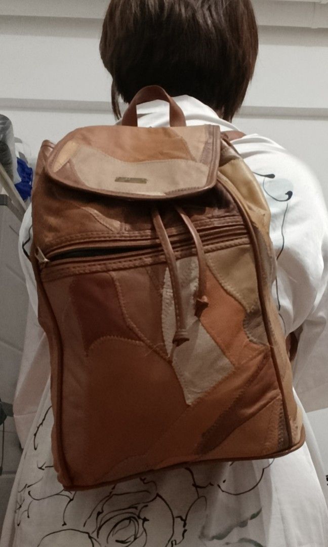 Patchwork Leather Backpack (Category: Backpacks) located in Manila. Submitted by beckylafea (Listing ID 1447330165, Image 3). Description: - Cool patchwork leather backpack - Assorted brown and tan shades - Drawstring closure with flap top - Zippered main compartment - Adjustable straps - Unique design - Ideal for everyday use or travel No rips ,no holes ,no bakbak. very clean inside .