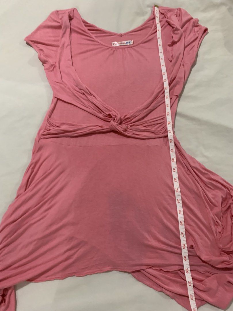 Pink Twisted Drape Asymmetrical Hem Dress (Category: Dresses) located in Paranaque City. Submitted by vbvessentials (Listing ID 1447998965, Image 3). Description: - Pink FUDANG dress - Flattering twisted drape detail at the waist - Unique asymmetrical hemline - Comfortable short sleeves - Soft and flowy fabric - Versatile for casual outings or dressing up - Measurements: Waist approx. 15 inches (laid flat), Length approx. 32 inches (shortest poin
