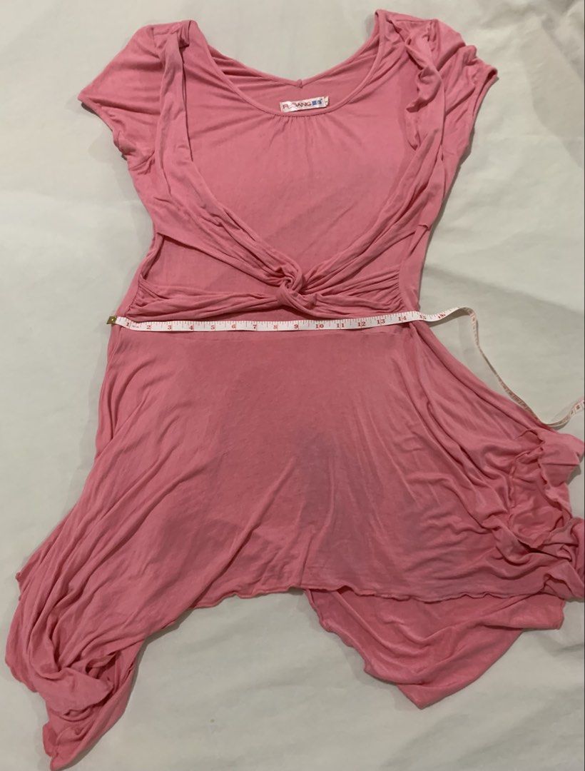 Pink Twisted Drape Asymmetrical Hem Dress (Category: Dresses) located in Paranaque City. Submitted by vbvessentials (Listing ID 1447998965, Image 2). Description: - Pink FUDANG dress - Flattering twisted drape detail at the waist - Unique asymmetrical hemline - Comfortable short sleeves - Soft and flowy fabric - Versatile for casual outings or dressing up - Measurements: Waist approx. 15 inches (laid flat), Length approx. 32 inches (shortest poin