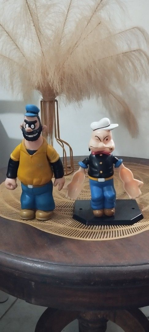 Popeye & Bluto Action Figures Set (Category: Figurines & Statues) located in Manila. Submitted by ventajetoyz625 (Listing ID 1447937157, Image 1). Description: - Set of Popeye and Bluto action figures - Bluto- 1991 Jollibee Popeye- 1970's KFS Robin - Base stand not included - Ideal for collectors and fans of the classic cartoon - With paint scratch on Bluto - What you see is what you get.