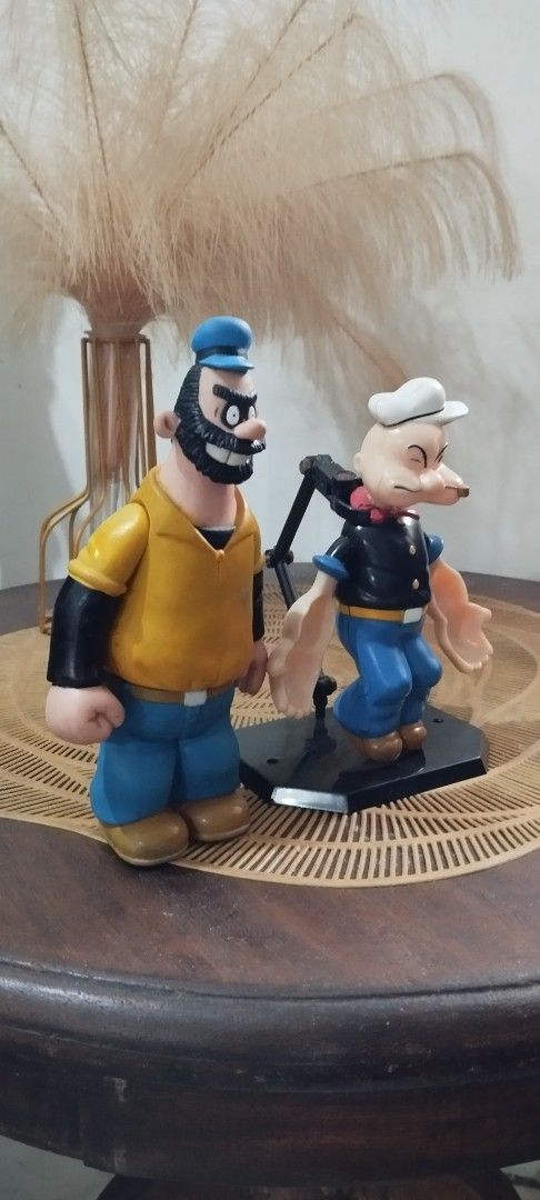 Popeye & Bluto Action Figures Set (Category: Figurines & Statues) located in Manila. Submitted by ventajetoyz625 (Listing ID 1447937157, Image 2). Description: - Set of Popeye and Bluto action figures - Bluto- 1991 Jollibee Popeye- 1970's KFS Robin - Base stand not included - Ideal for collectors and fans of the classic cartoon - With paint scratch on Bluto - What you see is what you get.