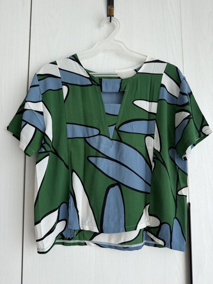 Printed V-Neck Top with Cut-out Detail (Category: Blouses) located in Manila. Submitted by qfclutz (Listing ID 1447983022, Image 2). Description: - Unique V-neck with cut-out detail with abstract print - Lightweight fabric - Easily pairs with pants or skirts - Available in 3 color options (red, green, dark blue) - BUY ALL 3 COLORS FOR ONLY P1,000 .