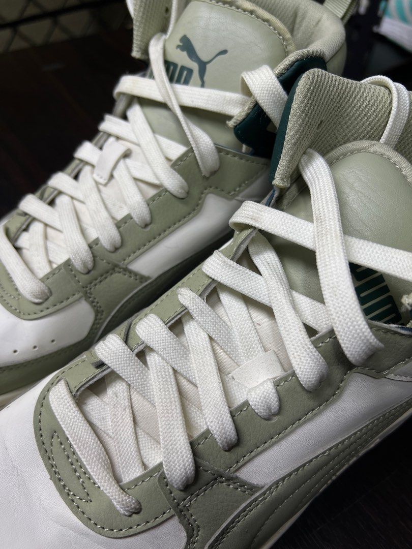 Puma High Top Sneakers - White/Green (Category: Sneakers) located in Marikina City. Submitted by lorenzothrifted (Listing ID 1447924916, Image 2). Description: - Puma high top sneakers (Used Once) - US 10.5 - Color: White with sage green and dark green accents - Style: Classic lace-up - Perfect for casual wear - Please check photos for detailed condition.