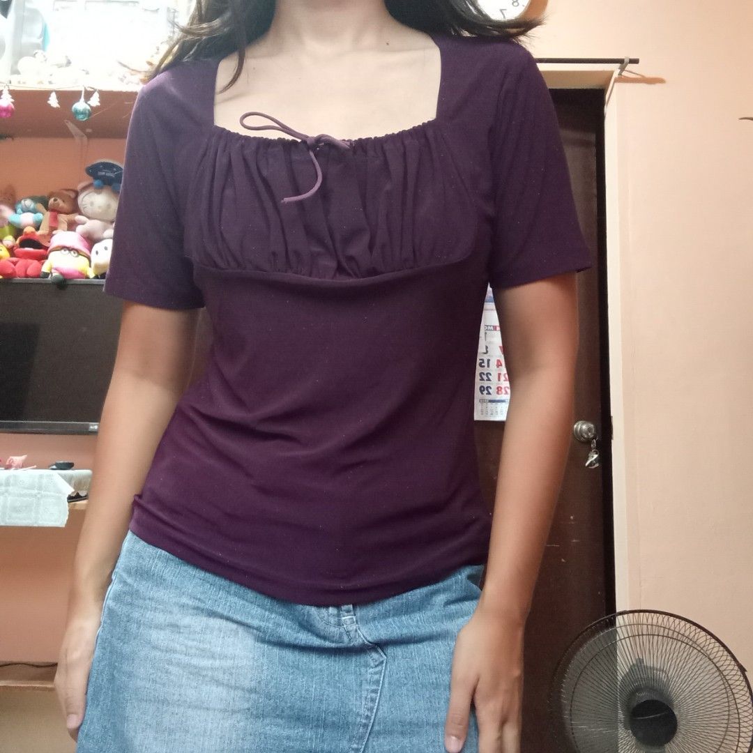Purple Ruched Square Neck Top with Drawstring (Category: Blouses) located in Talisay. Submitted by peonisces (Listing ID 1448008798, Image 2). Description: size small to med - Stylish purple top - Features a ruched front with drawstring detail - Flattering square neckline - Comfortable short sleeves - Fabric has a subtle shimmer - Versatile for pairing with jeans or skirts - Ideal for casual and chic everyday wear.