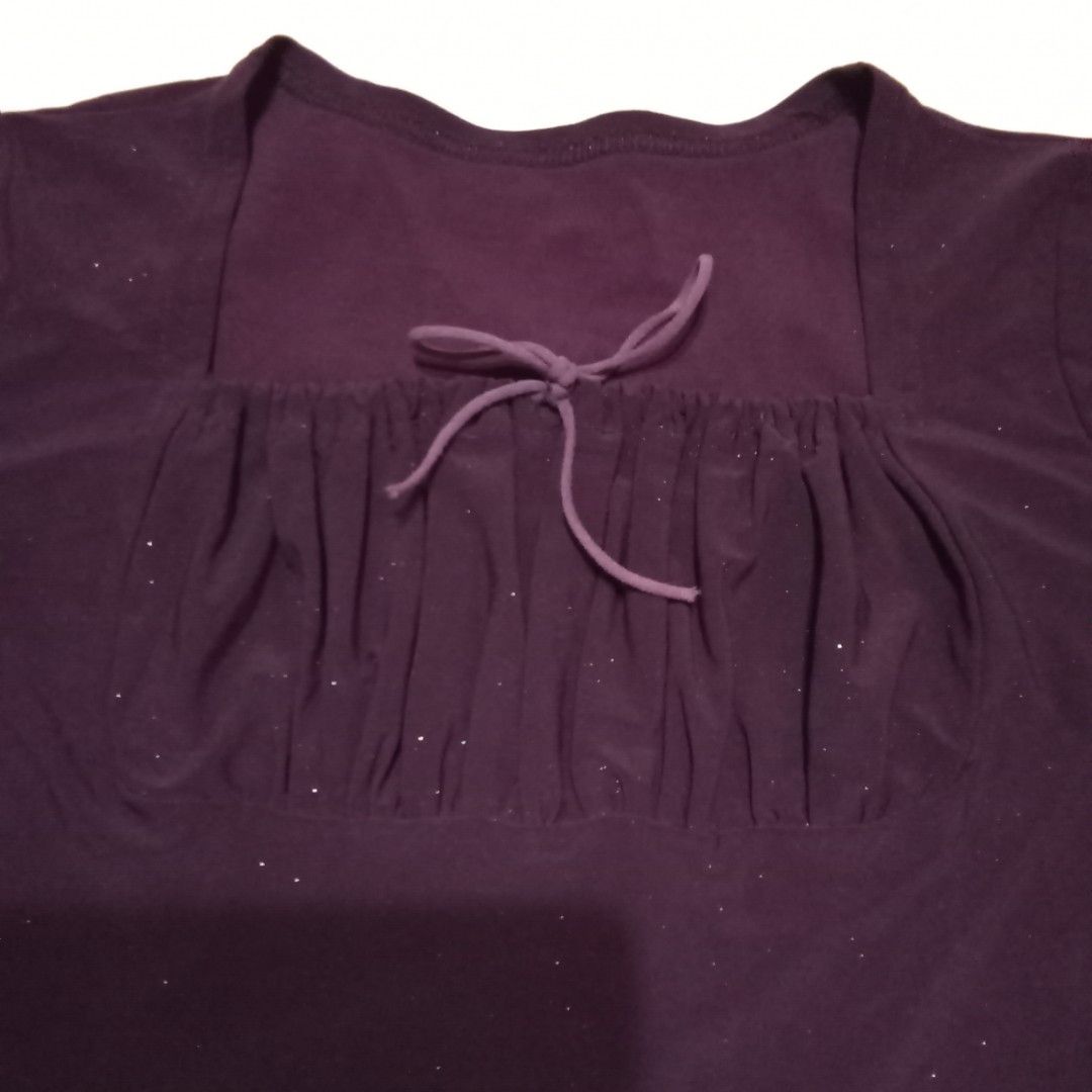 Purple Ruched Square Neck Top with Drawstring (Category: Blouses) located in Talisay. Submitted by peonisces (Listing ID 1448008798, Image 3). Description: size small to med - Stylish purple top - Features a ruched front with drawstring detail - Flattering square neckline - Comfortable short sleeves - Fabric has a subtle shimmer - Versatile for pairing with jeans or skirts - Ideal for casual and chic everyday wear.