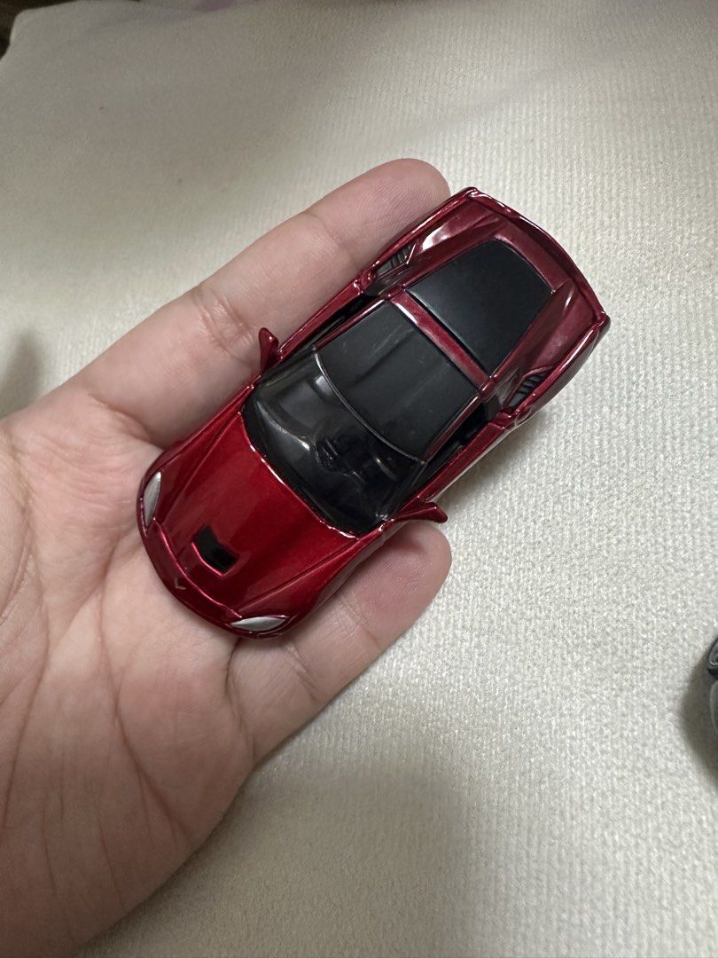 Red Sports Car Toy (Category: Vehicle & Diecast Models) located in Manila. Submitted by pixietink08 (Listing ID 1448014576, Image 1). Description: - Cool red sports car toy - Shiny metallic paint - Black tinted windows and roof - Great for collectors or kids - Small, hand-held size.