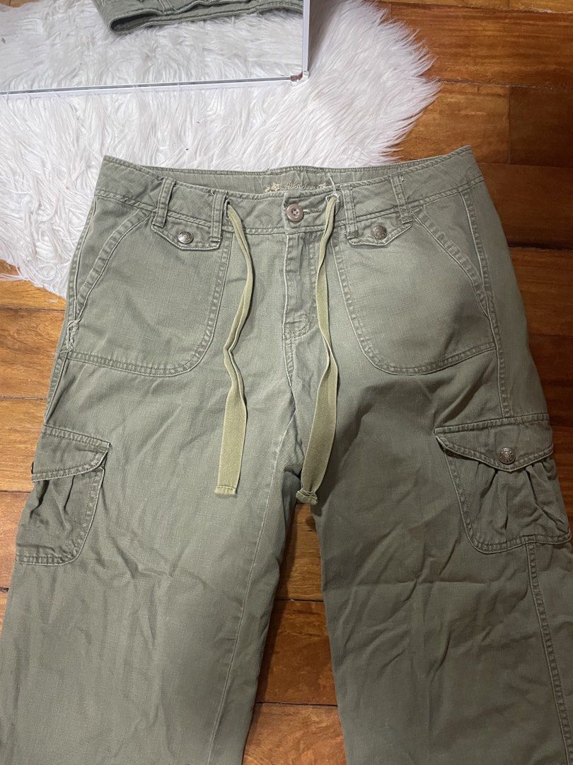 Rika Studios Olive Green Cargo Pants Wide Leg Drawstring (Category: Other Bottoms) located in Cainta. Submitted by FirstBuys (Listing ID 1447994043, Image 2). Description: - Olive green cargo pants from Rika Studios - Features a wide leg design - Adjustable drawstring waist for a comfortable fit - Multiple functional pockets throughout - Unique button closure on the side of the leg - Back pockets also have button closures - Ideal for creating a s