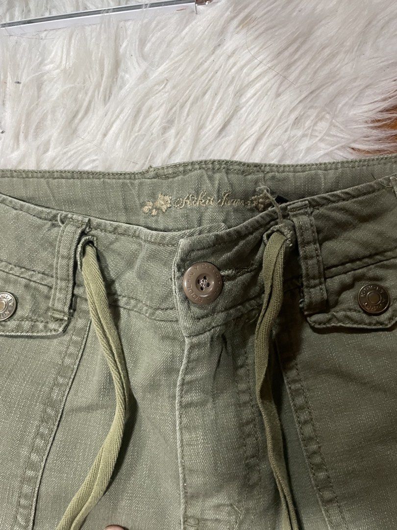Rika Studios Olive Green Cargo Pants Wide Leg Drawstring (Category: Other Bottoms) located in Cainta. Submitted by FirstBuys (Listing ID 1447994043, Image 3). Description: - Olive green cargo pants from Rika Studios - Features a wide leg design - Adjustable drawstring waist for a comfortable fit - Multiple functional pockets throughout - Unique button closure on the side of the leg - Back pockets also have button closures - Ideal for creating a s