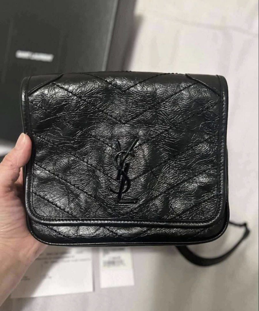 Saint Laurent Black Leather Chain Bag (Category: Luxury Bags & Wallets) located in Pasig City. Submitted by lalalooza (Listing ID 1447898378, Image 2). Description: - Authentic Saint Laurent black leather chain bag - Iconic black YSL logo - Quilted detailing on front flap - Includes original box and authenticity cards - Interior with multiple card slots - Black chain strap for shoulder or crossbody wear - Ideal for nights out or everyday use.